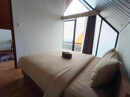 Katil atau katil-katil dalam bilik di Diorit Villa and Glamping