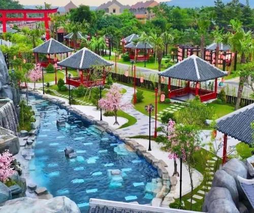 a resort with a pool and a playground at Biệt thự Đế Liên nguyên căn 2 tầng- Vườn Vua Resort Phú Thọ in Ðồng Phú