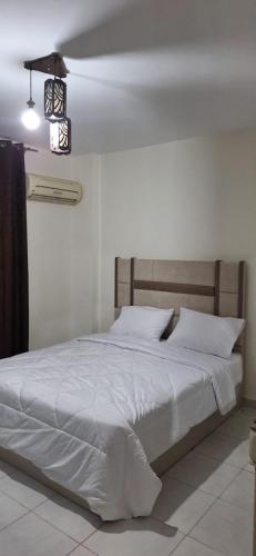 Ένα ή περισσότερα κρεβάτια σε δωμάτιο στο Jannat Madinaty