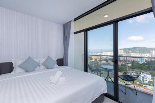 Letto o letti in una camera di CSJ Seaside - Căn Hộ Cạnh Biển