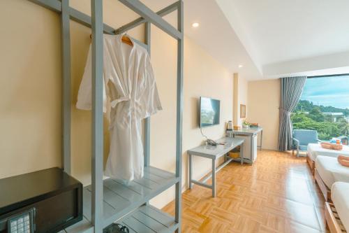 a room with a room with a living room at Golden Daisy Hotel Phu Quoc in Phu Quoc