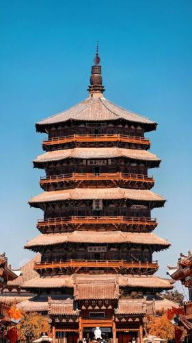 a tall building with a roof on top of it at 五福居 Five Blessings Hotel in Datong