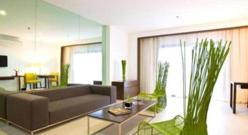 a living room with a couch and a table at Ciriaco Hotel in Calbayog City