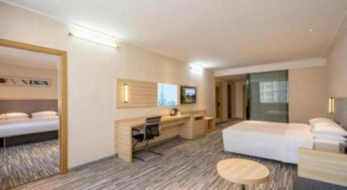 Letto o letti in una camera di City Comfort Inn Zhanjiang South Railway Station