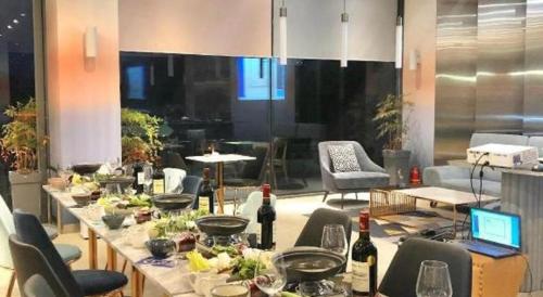 a long table with food on it in a room at Hotel Haus in Gapyeong