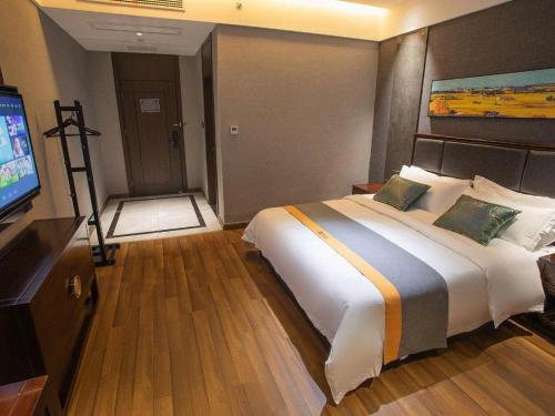 Postel nebo postele na pokoji v ubytování Shell Hotel Tai'an Feicheng Longshan Road