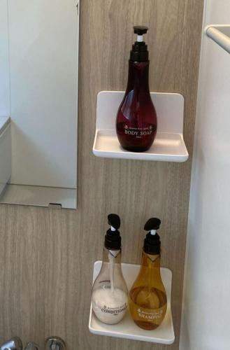 two bottles of alcohol in a refrigerator at Wine Inn Tomu - Vacation STAY 42199v in Katsunuma