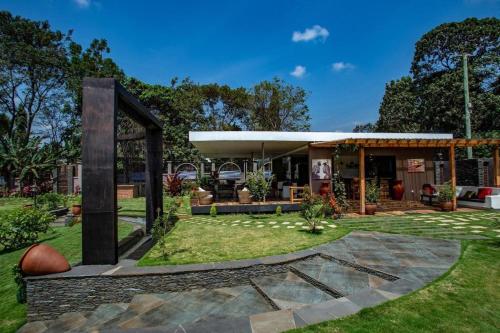 a house with a pavilion in a yard at Kinga Homes Boutique Hotel in Moshi