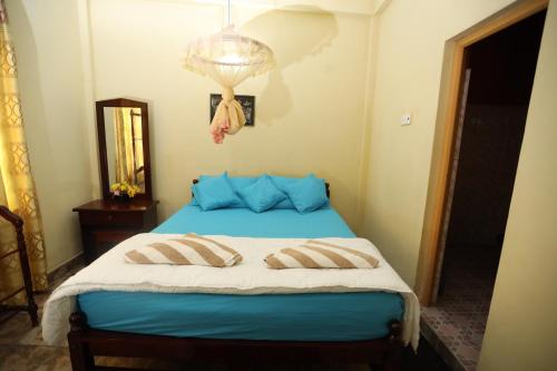 Postel nebo postele na pokoji v ubytování Kandy Paradise Resort & Spa