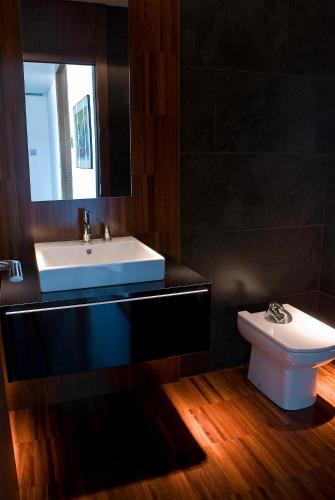 a bathroom with a sink and a toilet at Hotel Claytone Near Delhi Airport in New Delhi