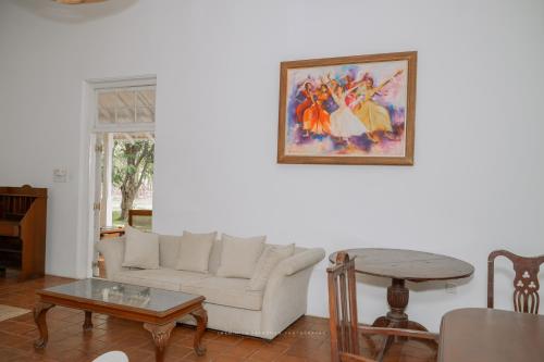 a living room with a couch and a table at Villa near Negombo & Airport in Andimulla