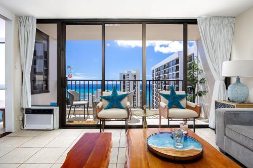 a living room with a view of the ocean at 34FL Deluxe Living in Waikiki - Ocean View Condo with Parking in Honolulu