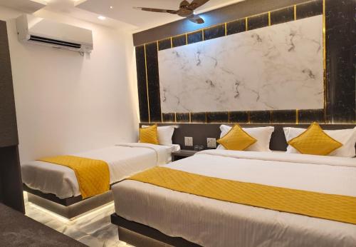 Un ou plusieurs lits dans un hébergement de l'établissement Sara Happy Stay Hotel