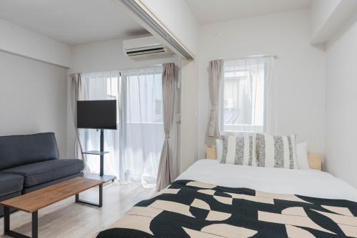 Ένα ή περισσότερα κρεβάτια σε δωμάτιο στο Gion Stay