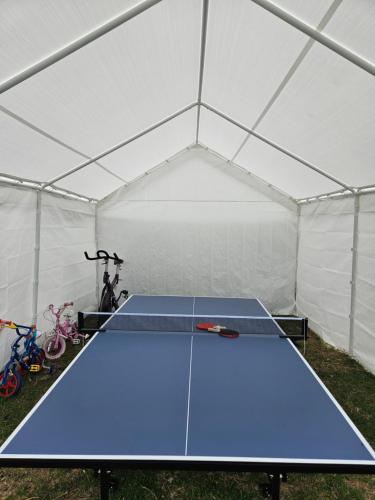 a ping pong table in a tent at Sunrise Haven Holiday Apartments Barbados in Christ Church