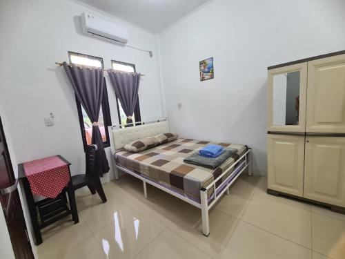 Postel nebo postele na pokoji v ubytování GG Homestay