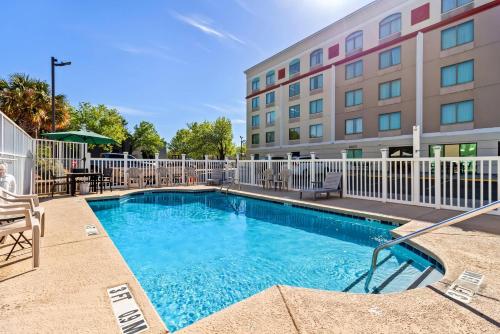 a swimming pool in front of a hotel at Quality Inn & Suites North Myrtle Beach in Myrtle Beach