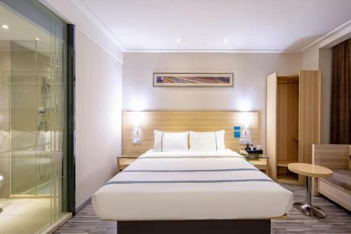Letto o letti in una camera di City Comfort Inn Nanning Railway Station