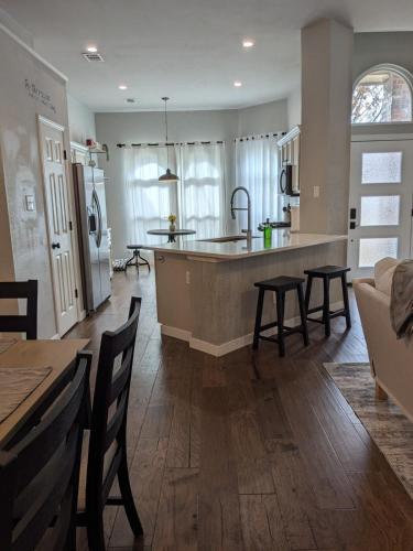 a kitchen with a island in the middle of a room at Rockwall Harbor Retreat in Rockwall