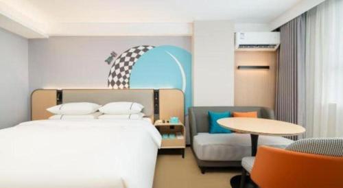 Postel nebo postele na pokoji v ubytování City Comfort Inn Beihai Hepu Bus Terminal