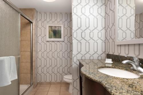 a bathroom with a sink and a toilet at Hampton Inn & Suites Wilkes-Barre in Wilkes-Barre