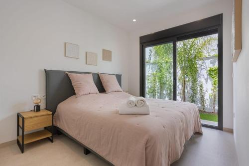 Postel nebo postele na pokoji v ubytování Villa Feliz