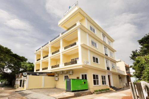 a building with a green door in front of it at Blue Mount in Kuilapayam