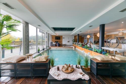 a pool in the middle of a house at Vacances de rêves - Olympique in Chamrousse