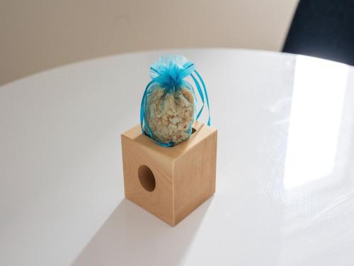 a pineapple sitting on top of a box on a table at Gailtaler apartment at an excursion location in Kötschach