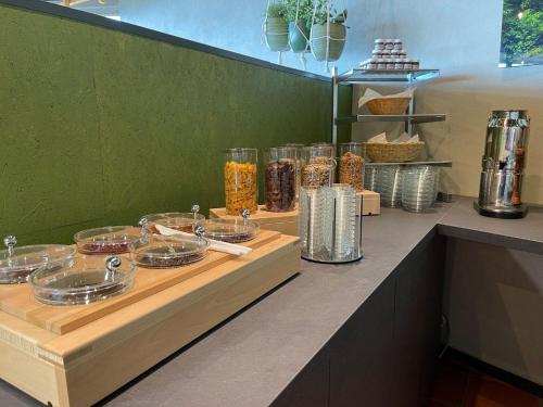 a counter with plates of food on top at Inviting apartment in Freyung with sauna & indoor pool in Freyung