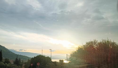 two people walking down a road at sunset at Ca' Pietra di Nonno Pietro in Gavardo