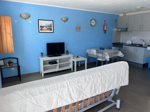a hospital room with a bed and a kitchen at cavaleiro guest house 800 meters from the sea in Odemira