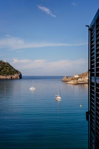 two boats in a large body of water at Hotel Esplendido in Port de Soller