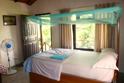 Ένα ή περισσότερα κρεβάτια σε δωμάτιο στο Bardia Homestay Pvt. Ltd.