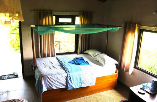 Ένα ή περισσότερα κρεβάτια σε δωμάτιο στο Bardia Homestay Pvt. Ltd.