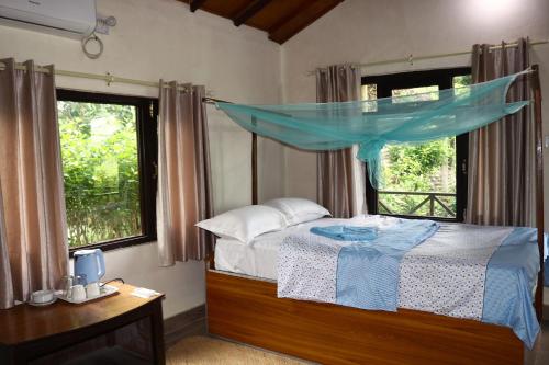 Ένα ή περισσότερα κρεβάτια σε δωμάτιο στο Bardia Homestay Pvt. Ltd.