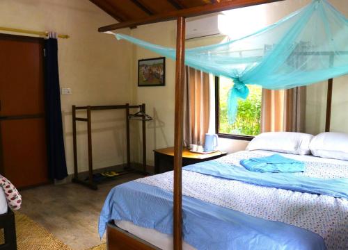 Ένα ή περισσότερα κρεβάτια σε δωμάτιο στο Bardia Homestay Pvt. Ltd.
