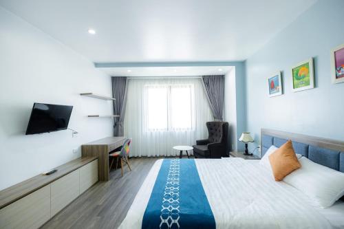 TV a/nebo společenská místnost v ubytování TQ5 Hotel & Apartment