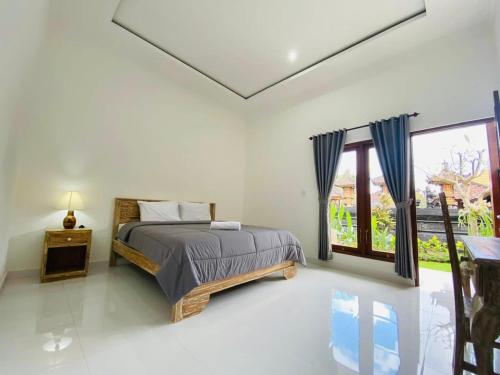 Giường trong phòng chung tại Lumbung Guesthouse Canggu