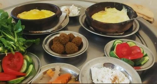 a group of bowls of food on a table at Pro Luxor guest house in Luxor