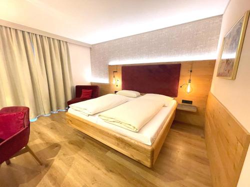 Ένα ή περισσότερα κρεβάτια σε δωμάτιο στο Hotel Gasthof Ziegelhütte