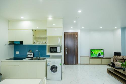 Kuchyň nebo kuchyňský kout v ubytování TQ5 Hotel & Apartment