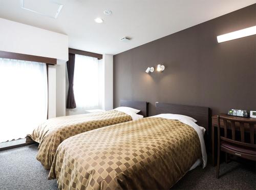 Una cama o camas en una habitación de Hotel Trend Asakusa Annex