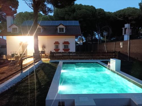 a swimming pool in front of a house at Casa Selene in El Puerto de Santa María