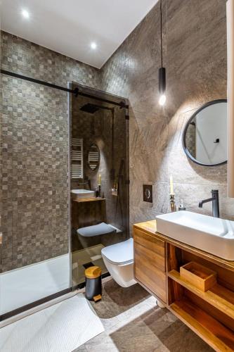 a bathroom with a toilet and a sink and a shower at Family villa in Marrakech in Marrakesh