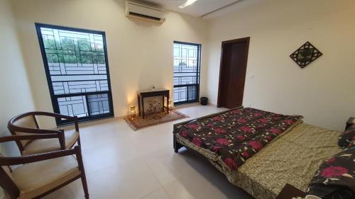 a bedroom with a bed and a fireplace in it at AA Loft in Lahore