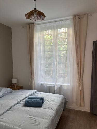 Ένα ή περισσότερα κρεβάτια σε δωμάτιο στο Saint-Fons centre appartement meublé