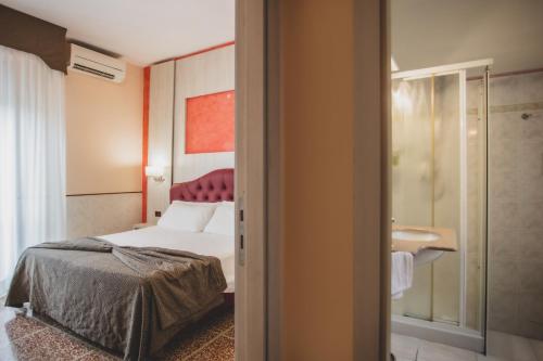 Ein Bett oder Betten in einem Zimmer der Unterkunft Hotel La Pace