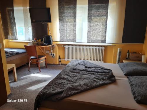 Postel nebo postele na pokoji v ubytování Golden Rangau Hotel & Pension