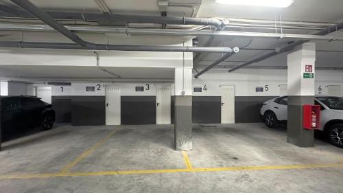 a parking garage with two cars parked in it at Corral del Carbón GG Luxury Hotel Boutique in Granada
